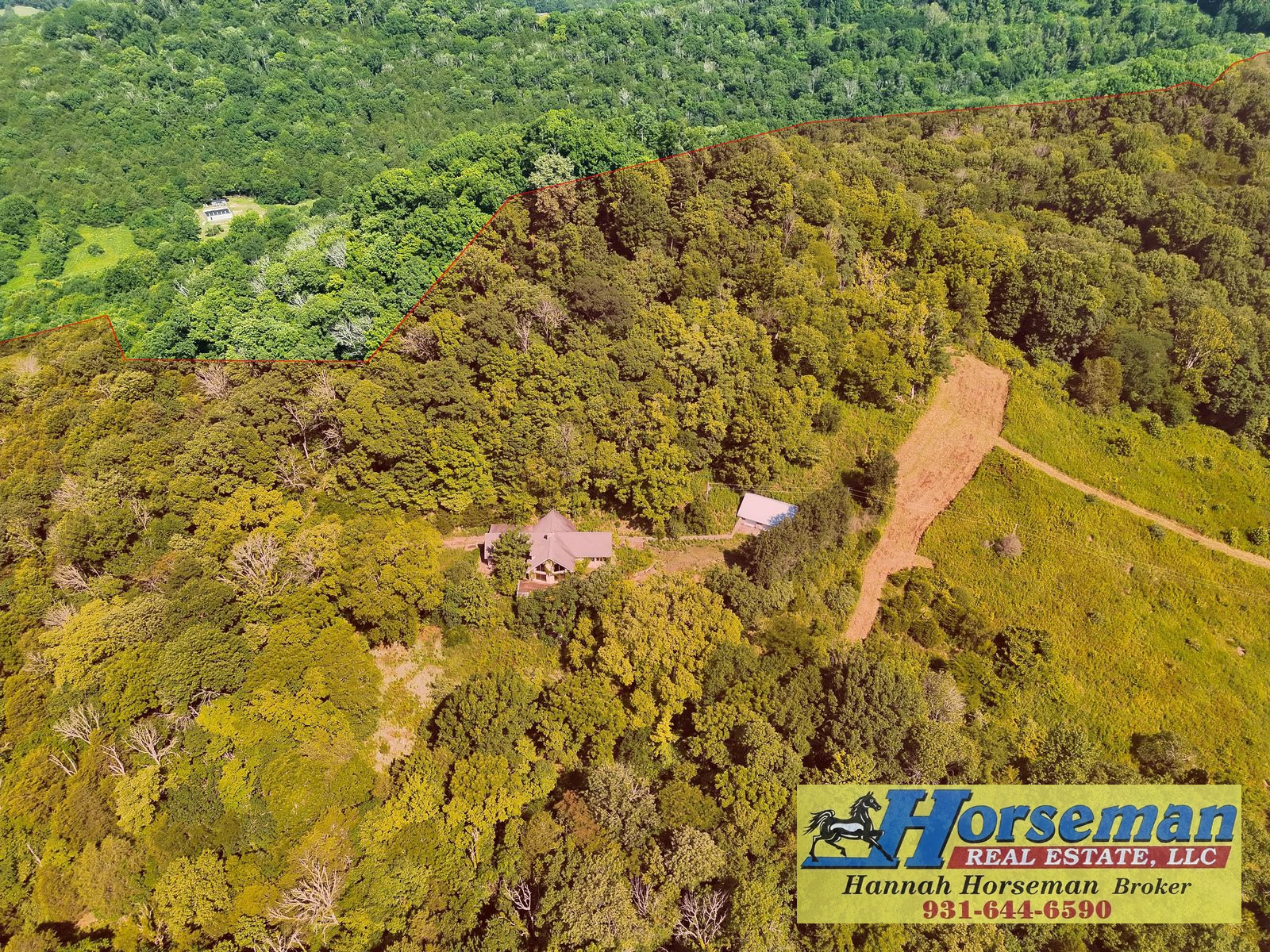 Aerial property image with a parcel boundary overlay and Horseman Real Estate watermark